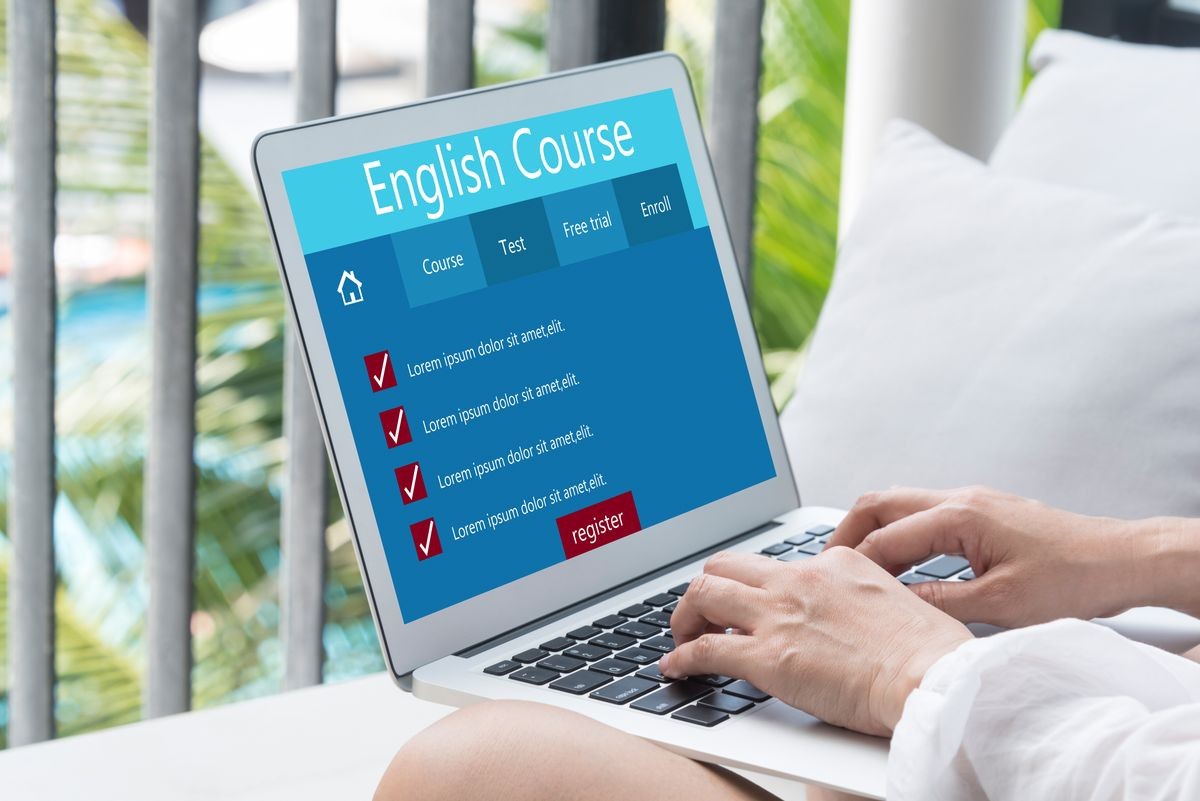 Learn English concept, Use laptops and smartphones to find English learning information on the web.