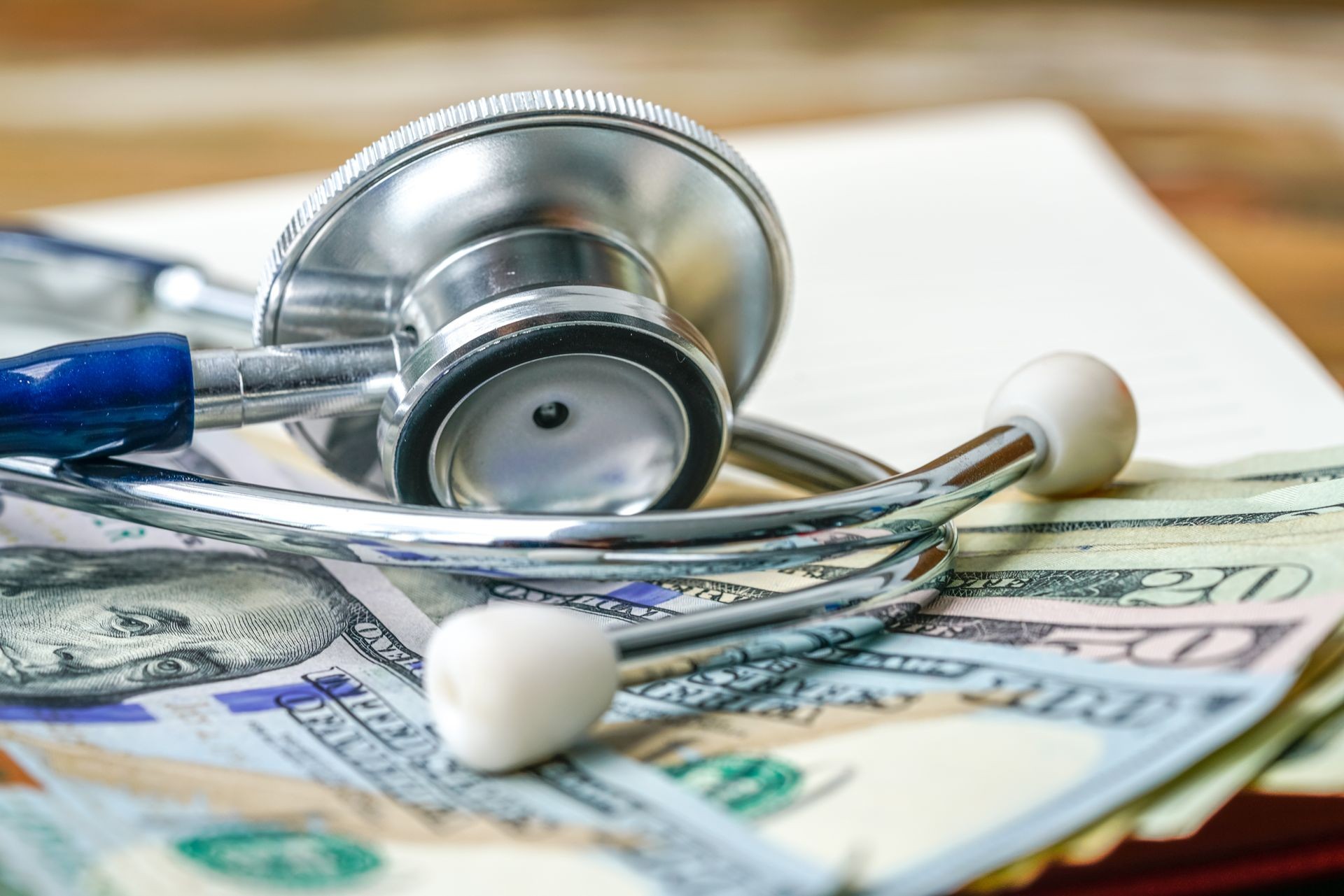 Stethoscope and banknote with healthcare concept.